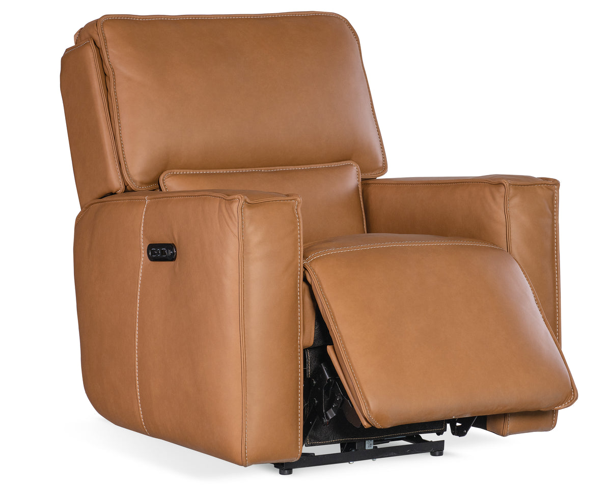 a brown recliner chair with white stitching