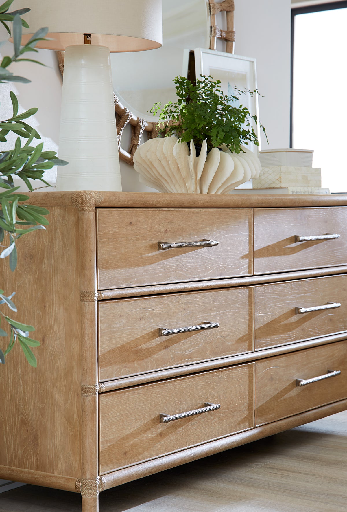 a dresser with a plant on top