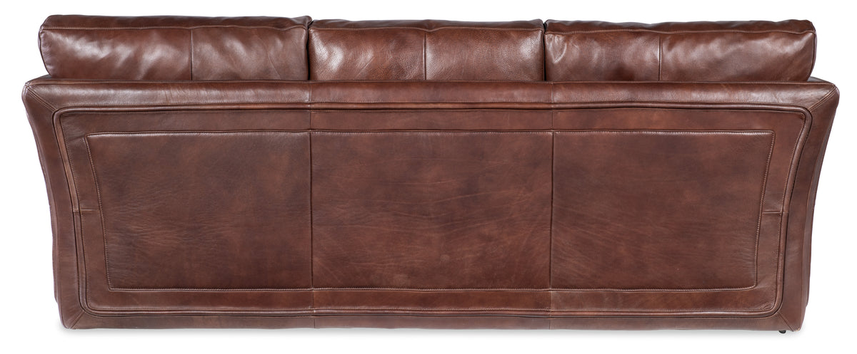 a brown leather couch with a white background