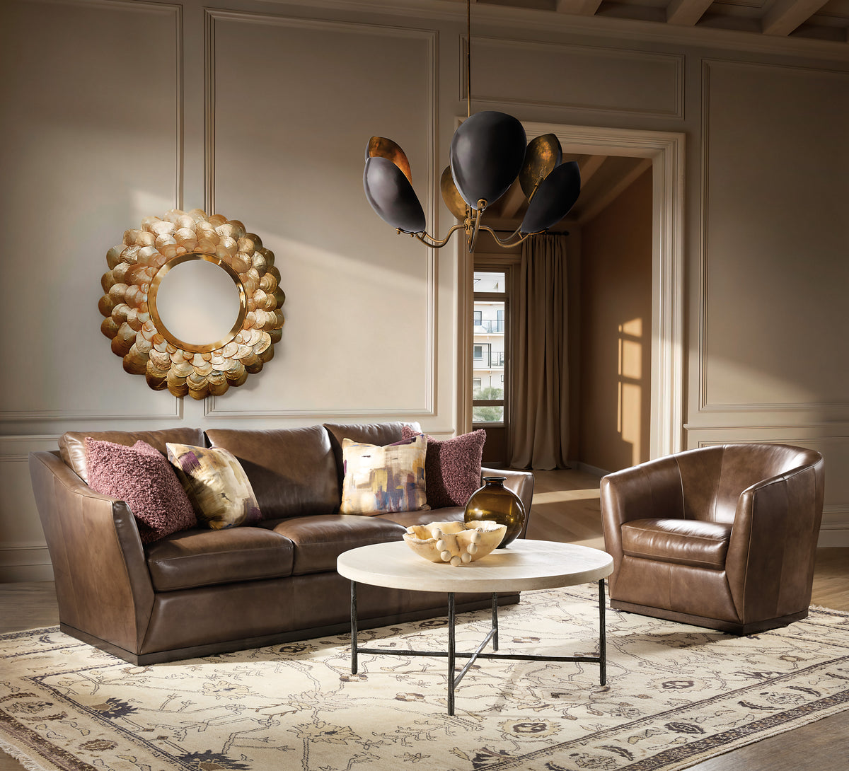 a living room with a couch and chairs