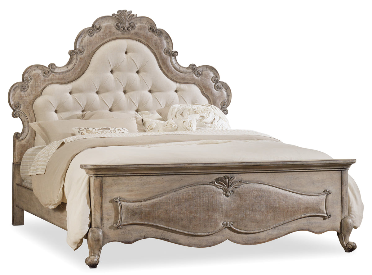 a bed with a white headboard