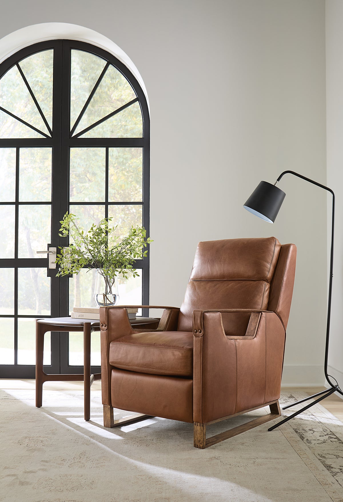 a brown leather chair in a room