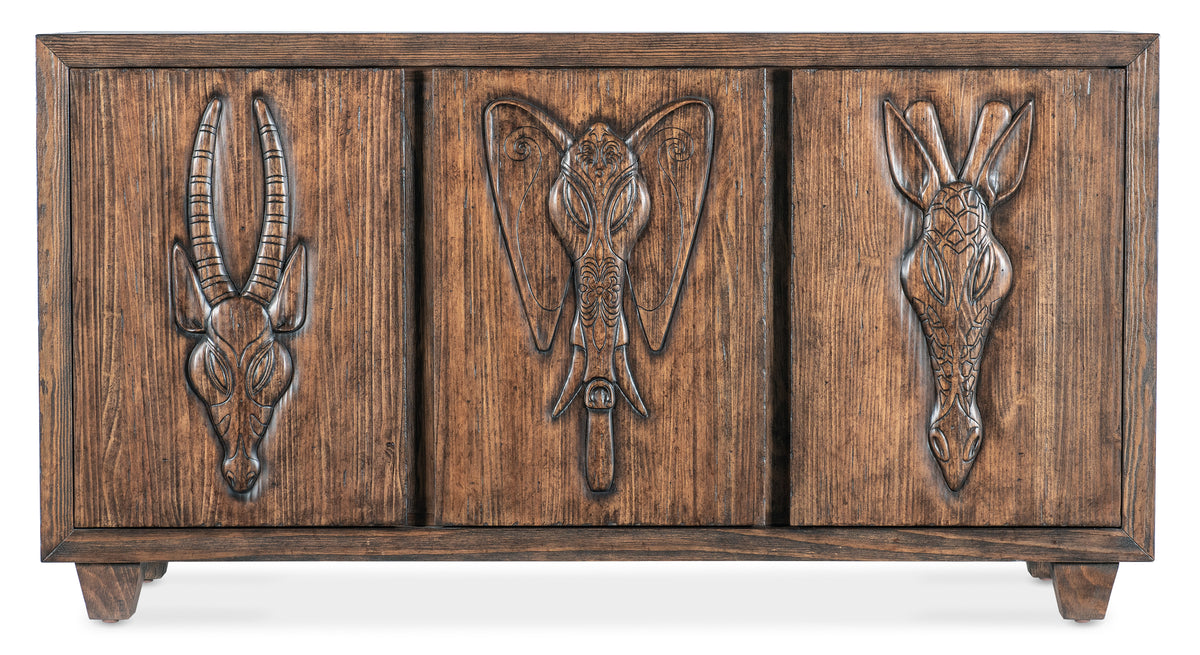 a wood panel with carved animals