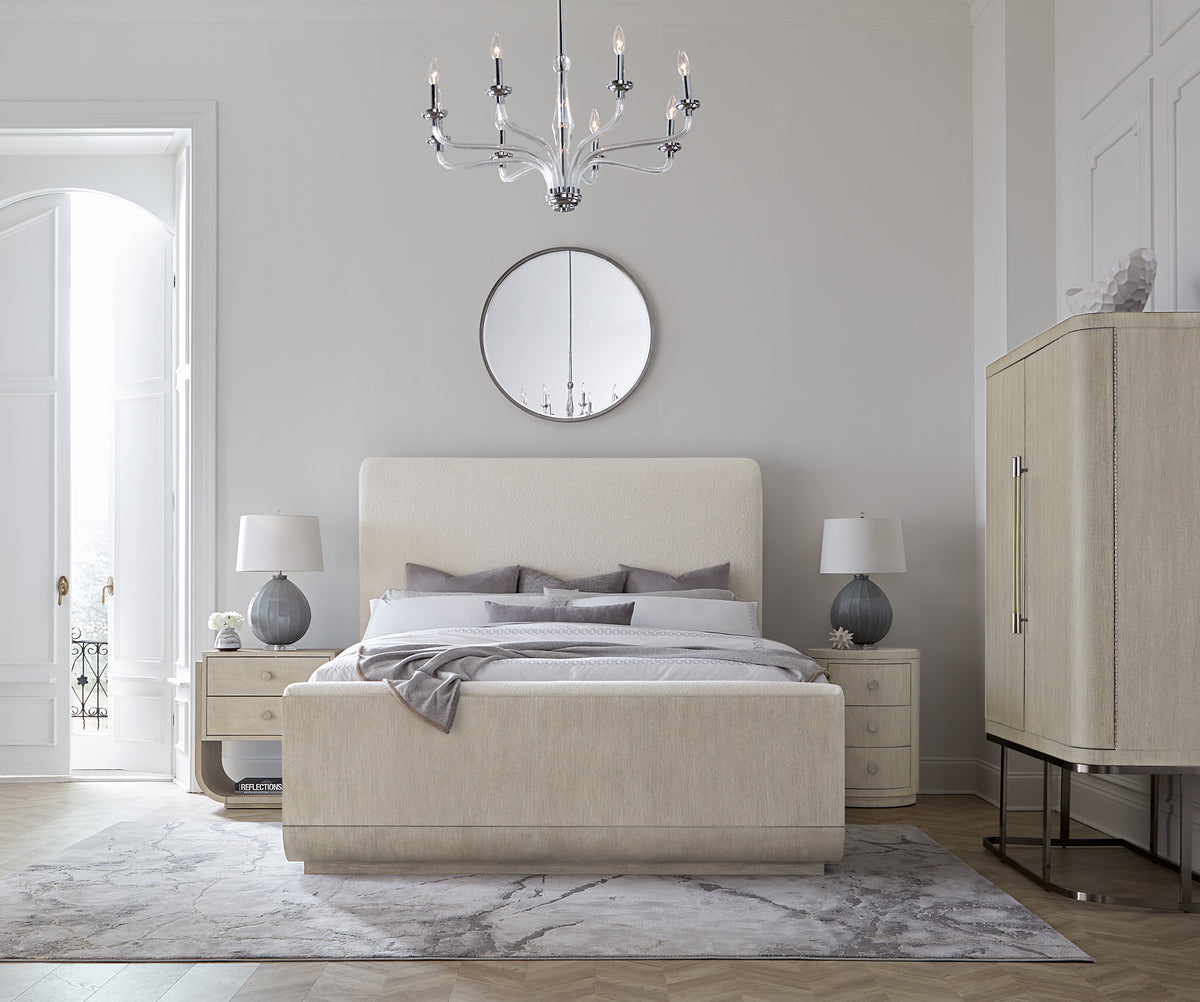 a bedroom with a bed and a mirror