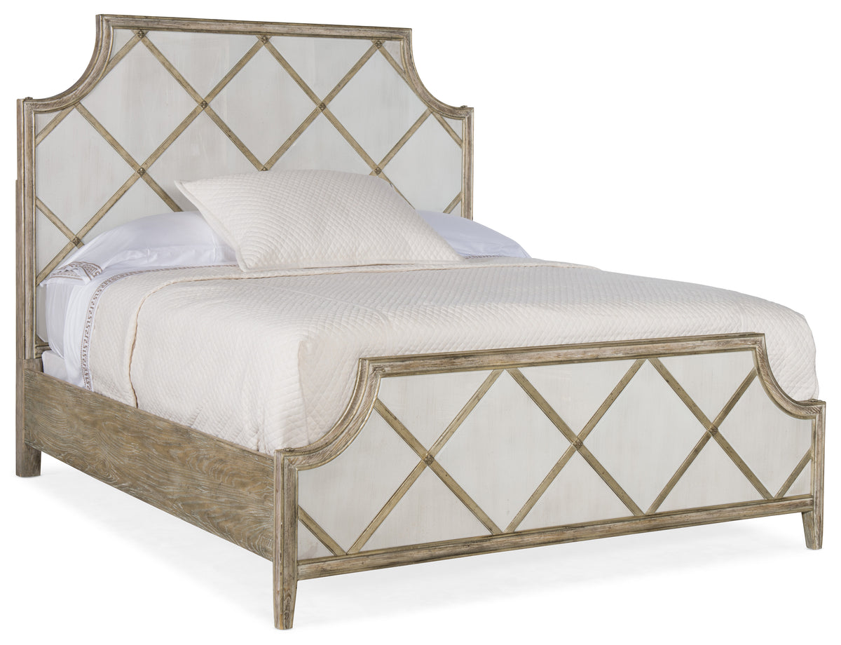 a bed with a white headboard
