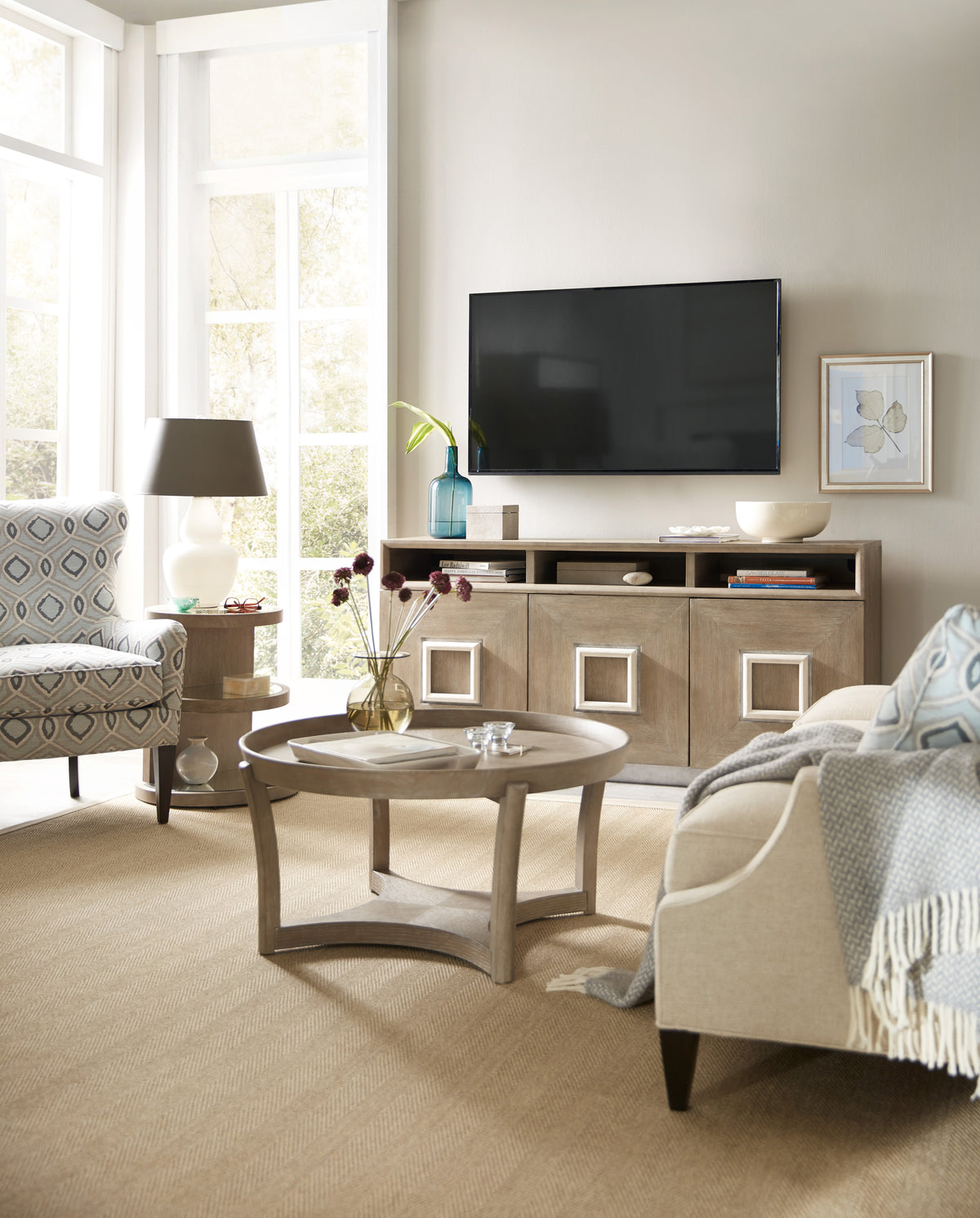 a living room with a television on the wall