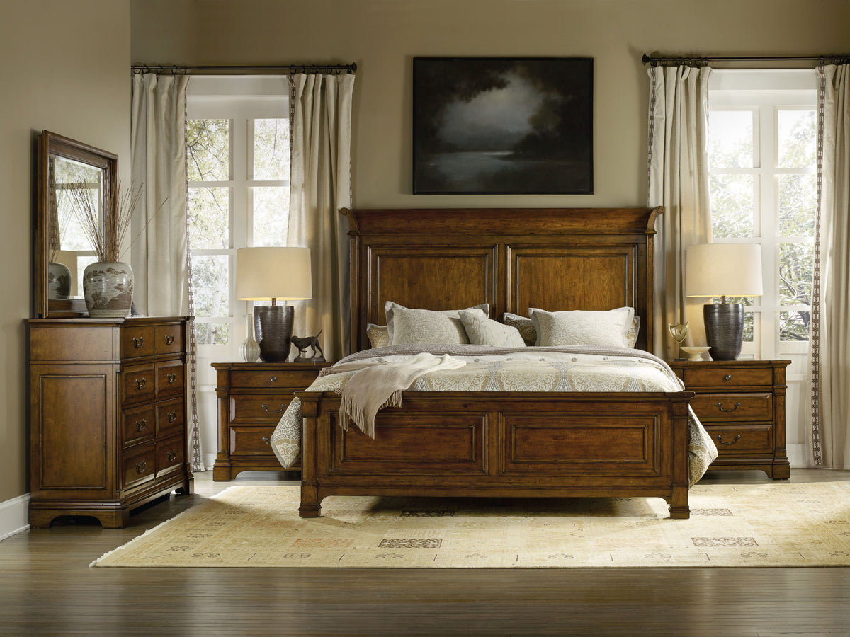 a bedroom with a bed and dresser