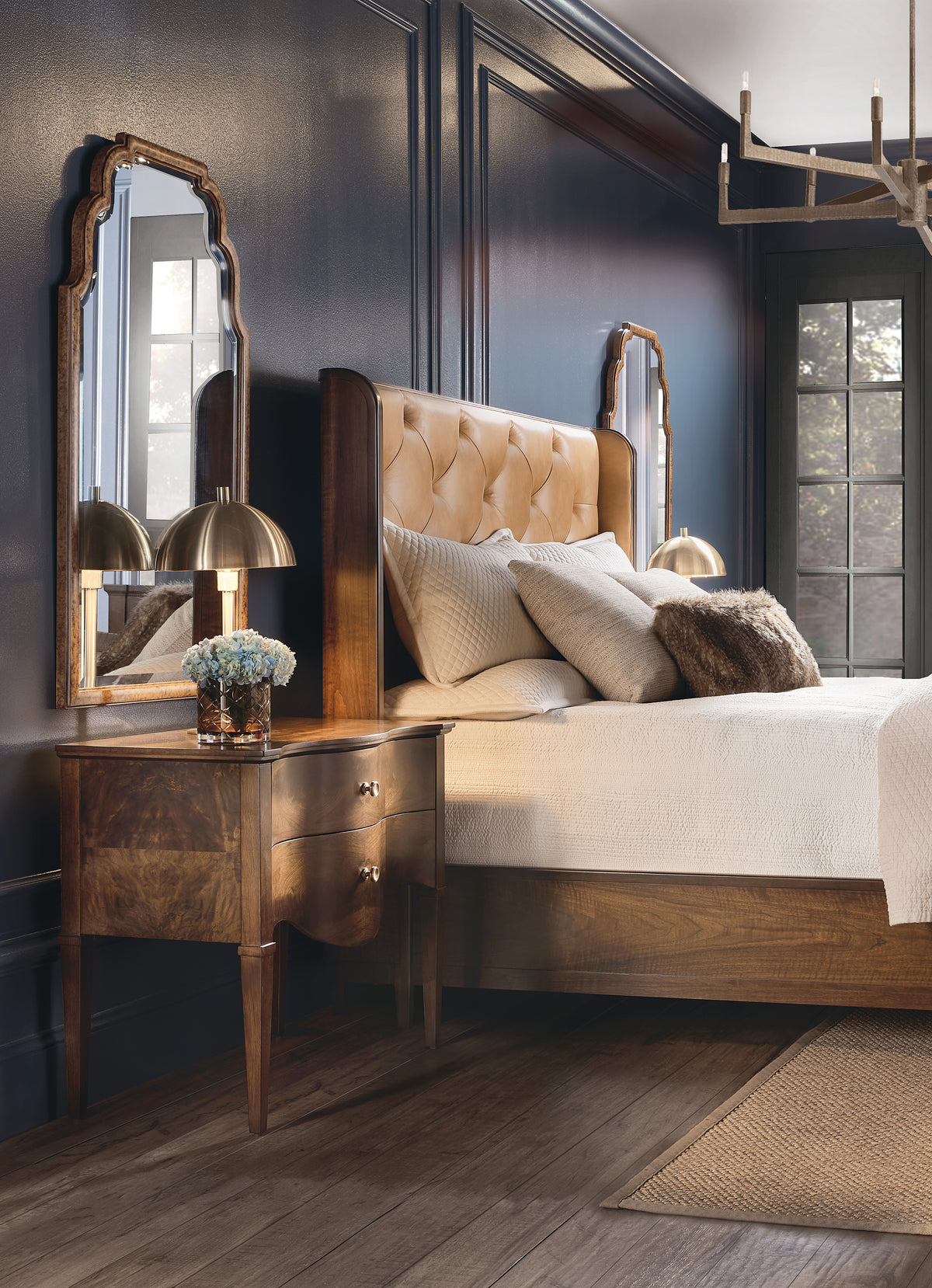 a bedroom with a bed and a night stand