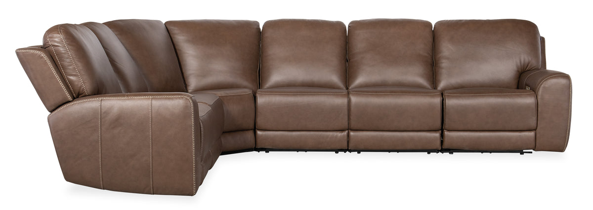 a brown leather couch with a corner arm rest