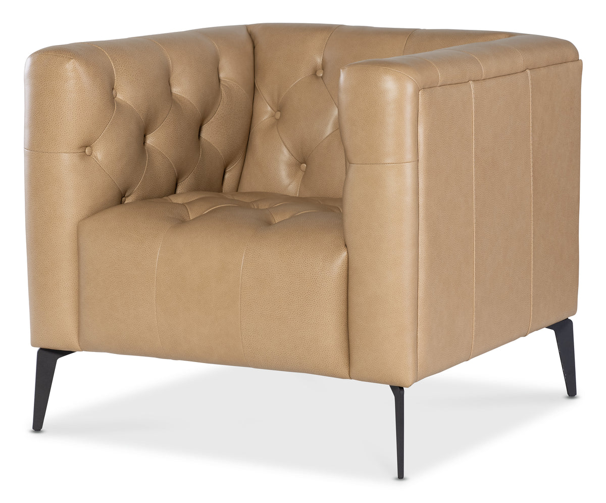 a tan leather chair with black legs