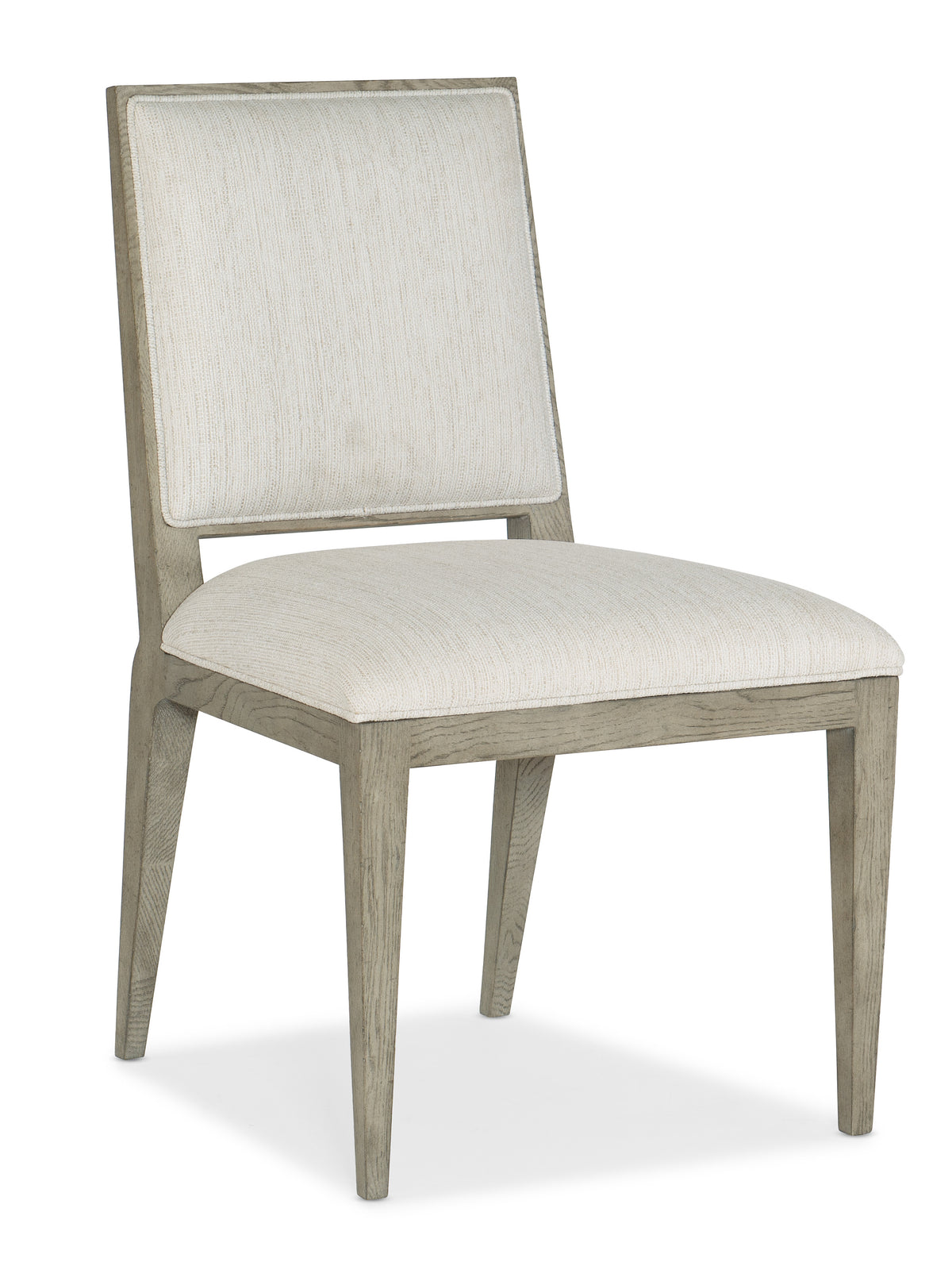 a white chair with a white cushion