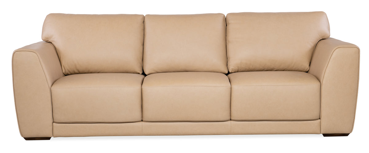 a tan couch with a white background