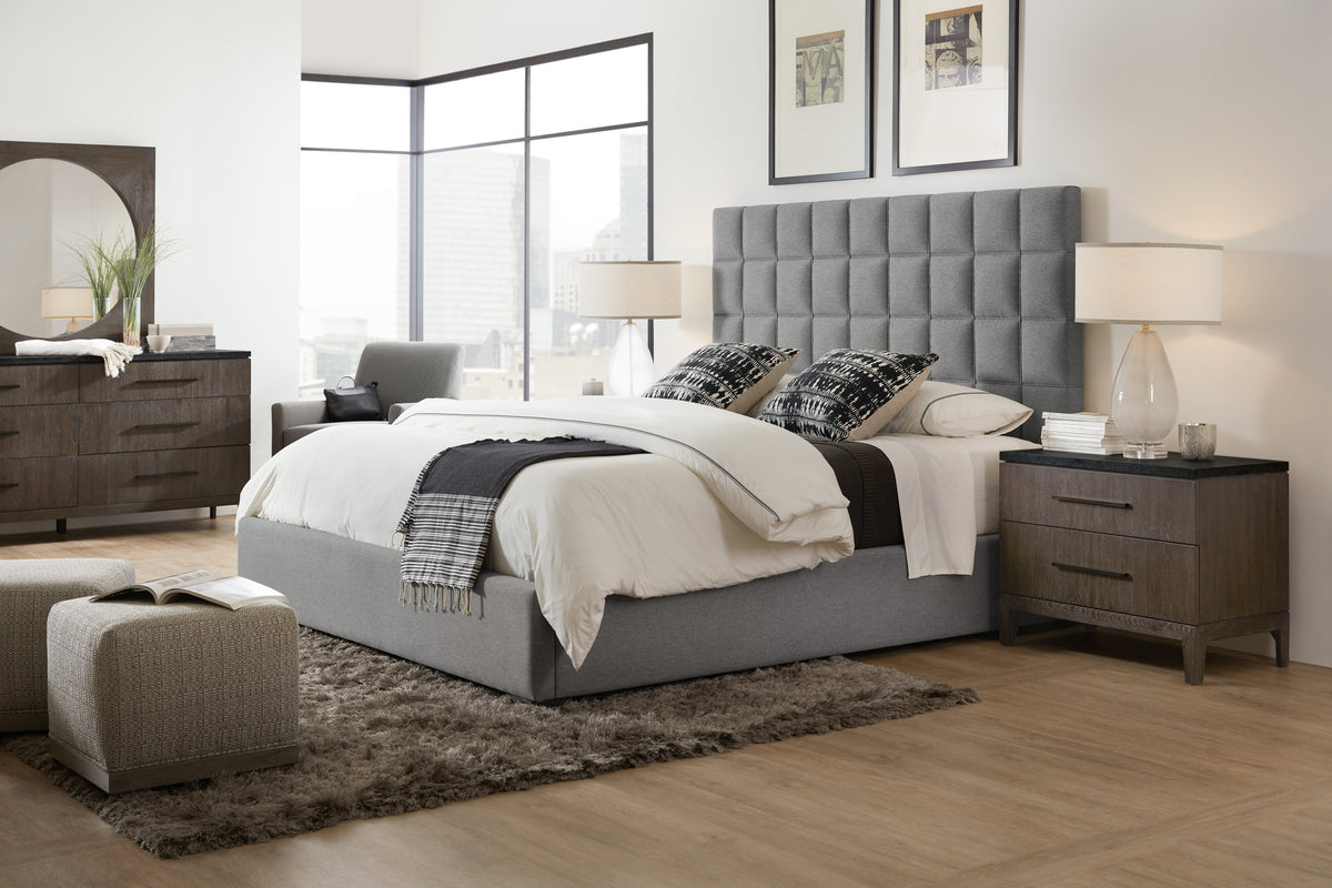 a bedroom with a bed and a rug
