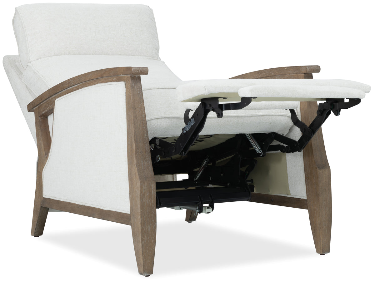 a white recliner with a wooden frame
