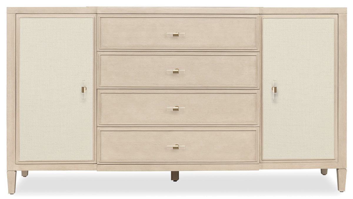 a white dresser with gold handles