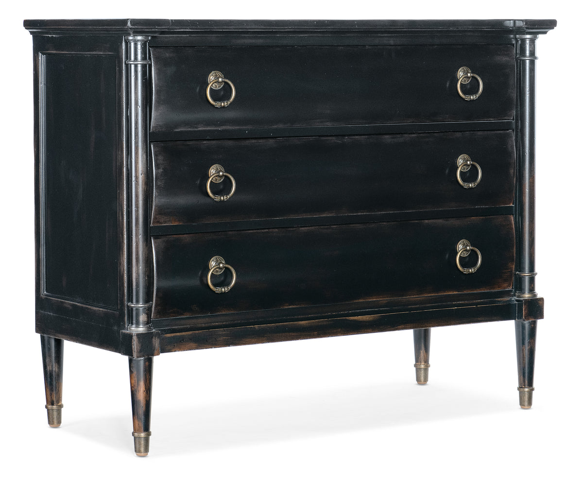 a black dresser with gold handles