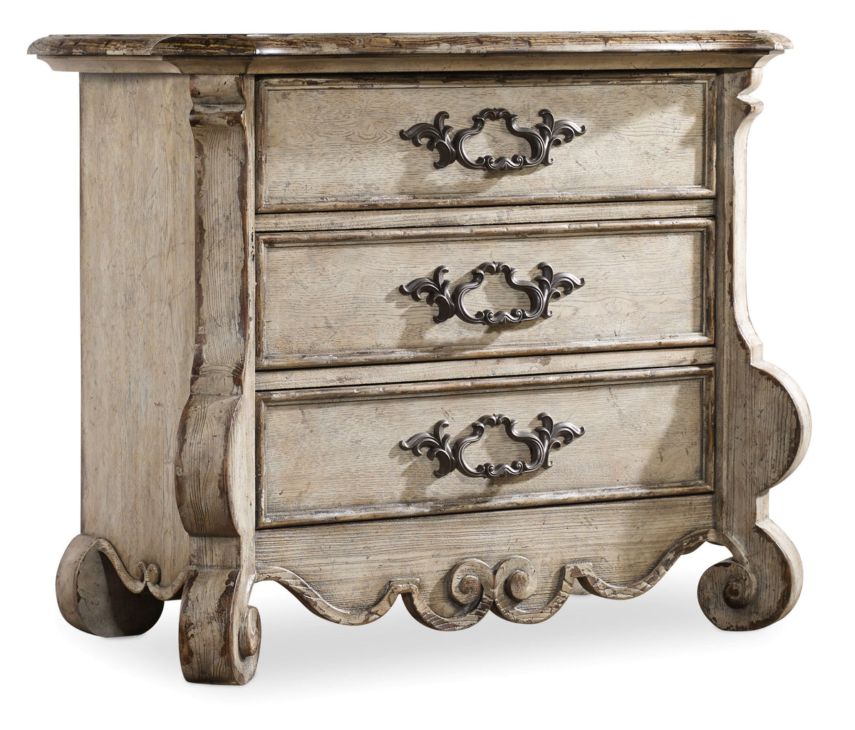 a white dresser with black handles