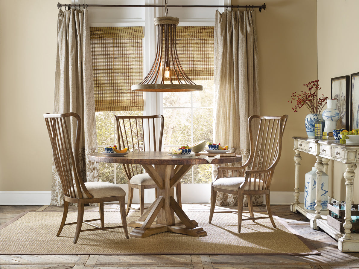 a dining room with a table and chairs
