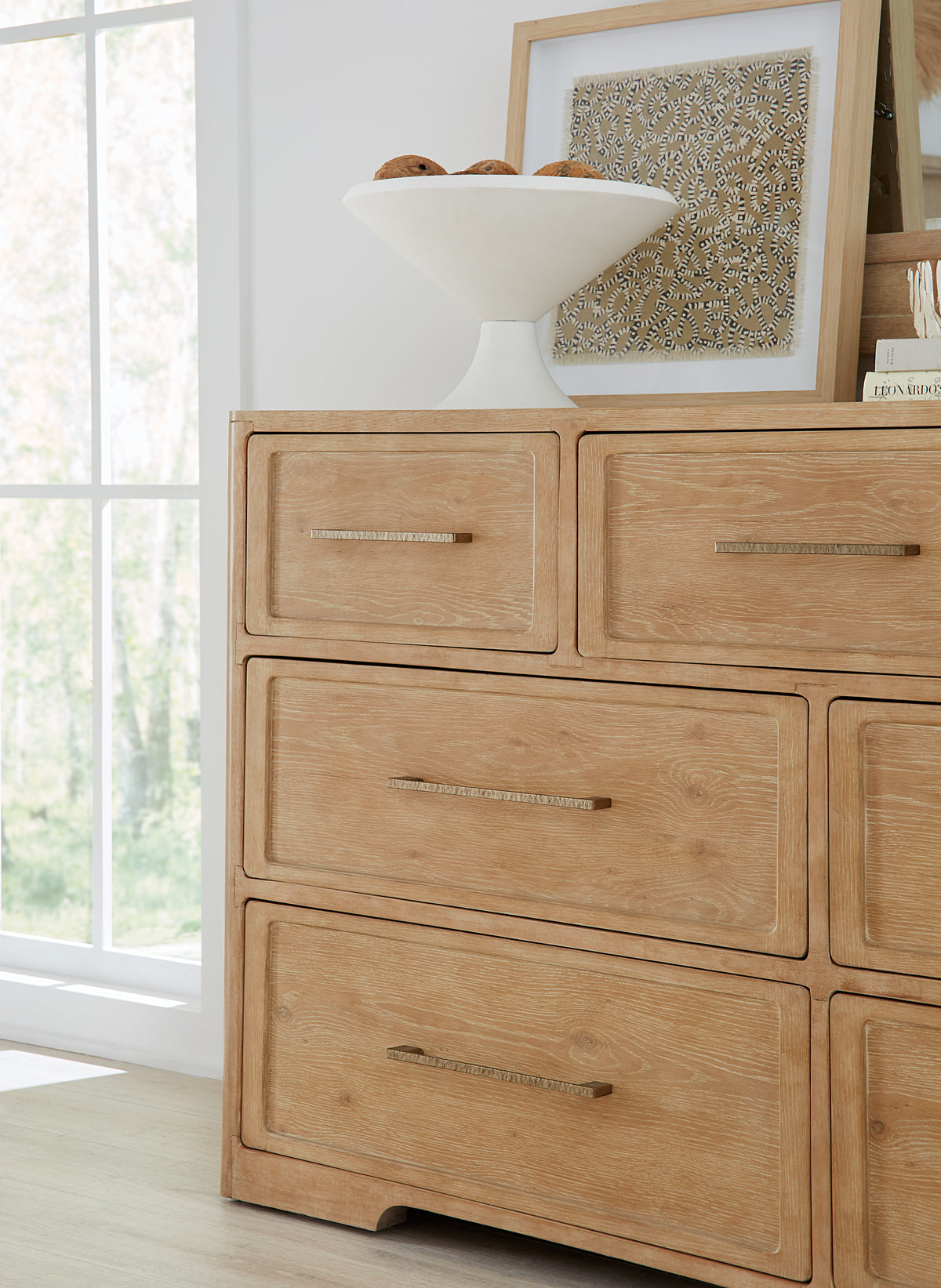 a dresser with a white bowl on top