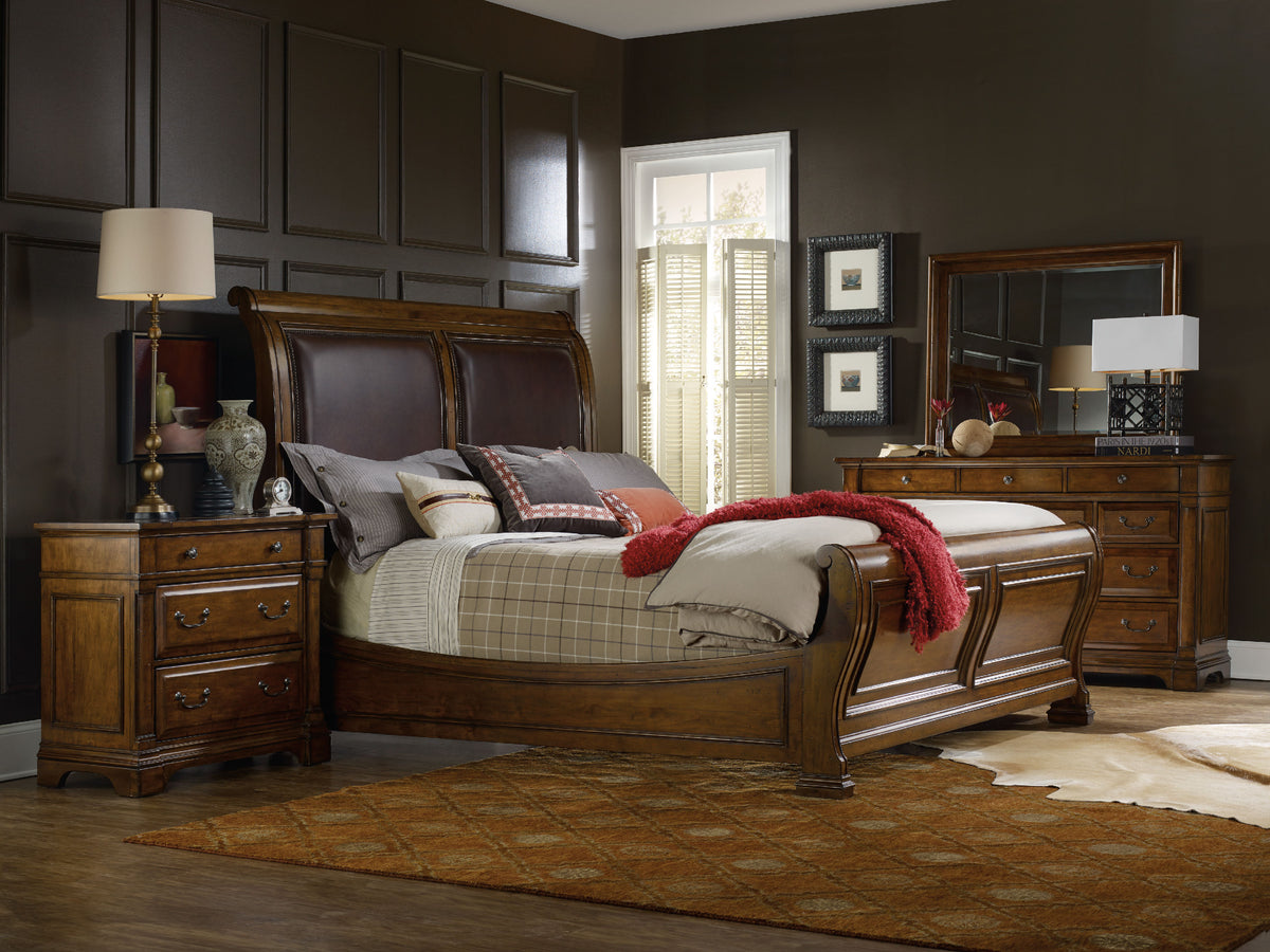 a bedroom with a bed and dresser