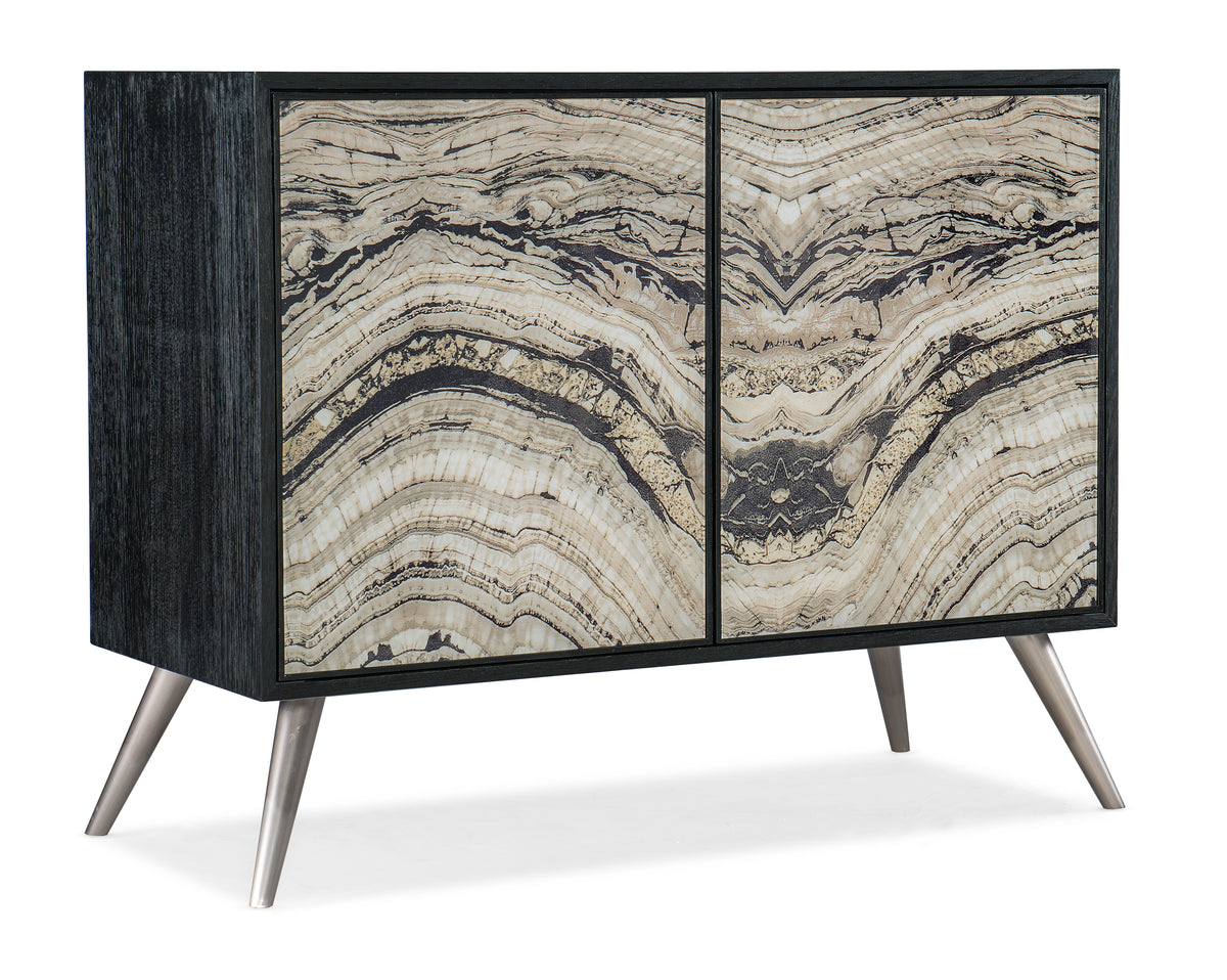 a black and white cabinet with metal legs