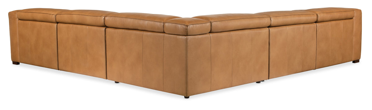 a brown leather corner chair
