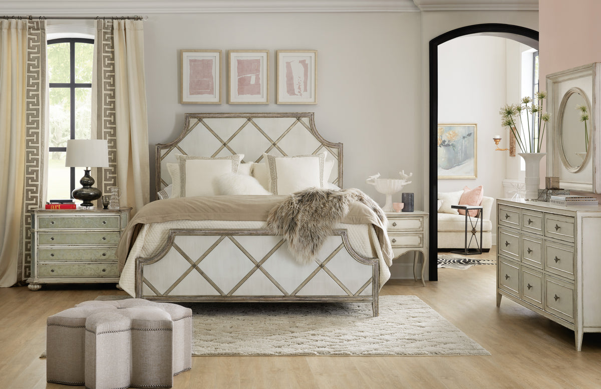 a bedroom with a bed and a mirror
