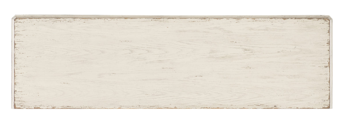 a white wood surface with a chipped edge