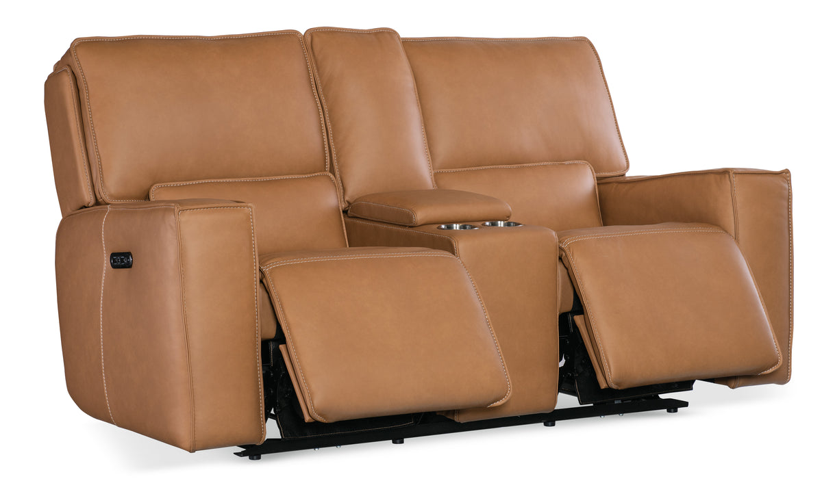 a brown leather couch with armrests