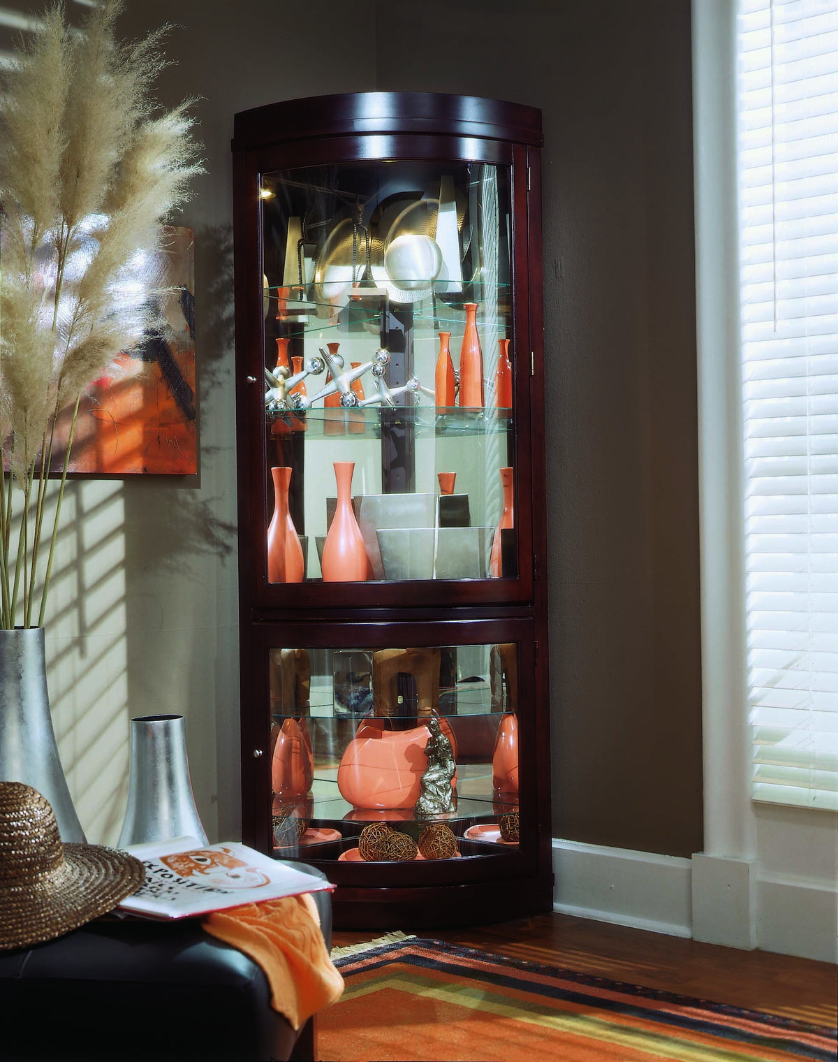 a glass cabinet with shelves and vases