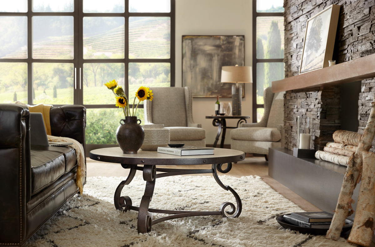 a living room with a fireplace and a coffee table