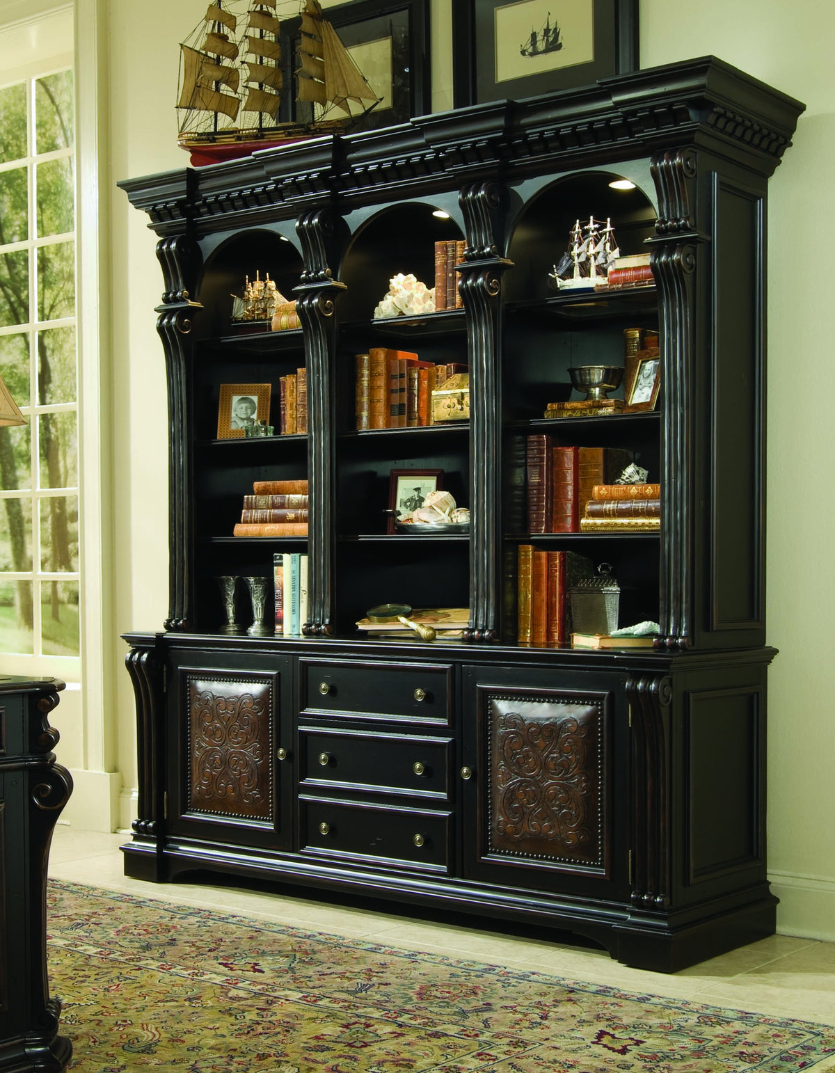a black bookcase with books on it