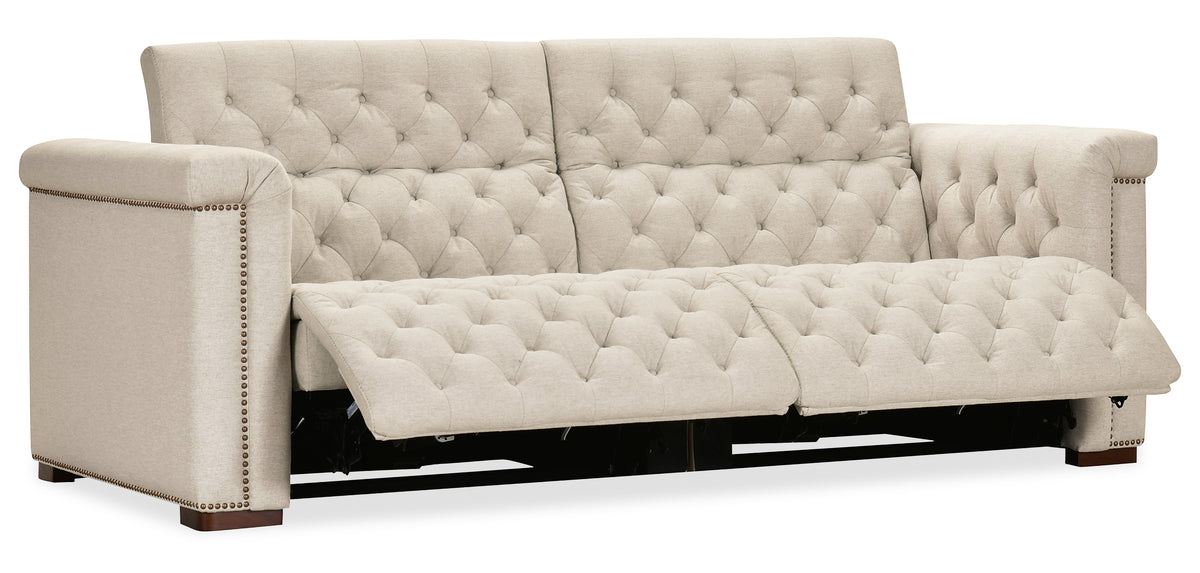 a white couch with a foot rest