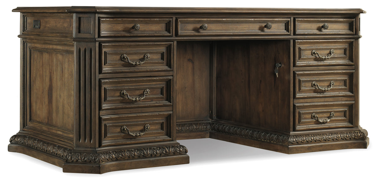 a wooden desk with a door open