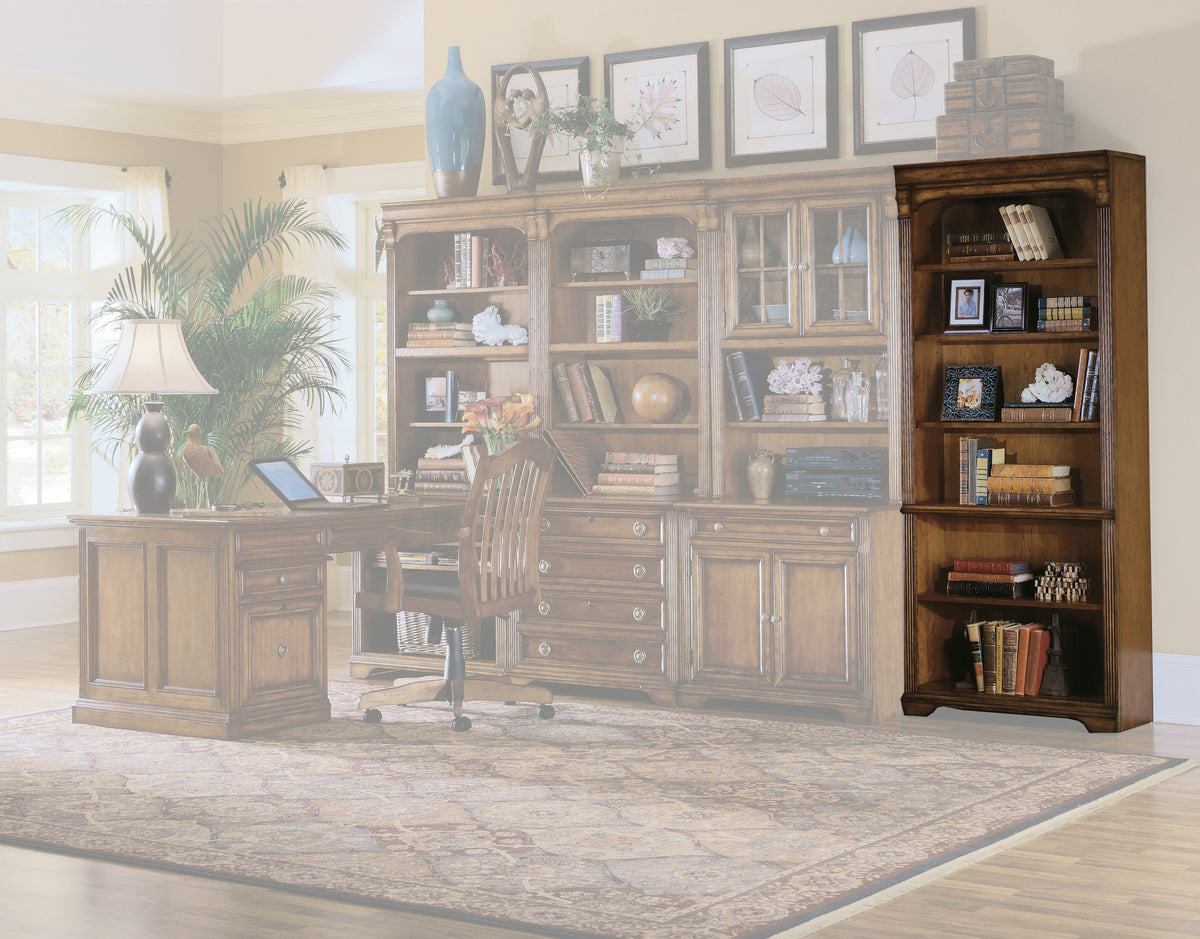 a room with a desk and a bookcase