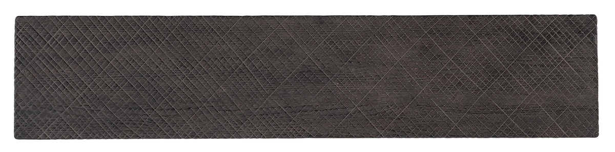 a black rug with a diamond pattern