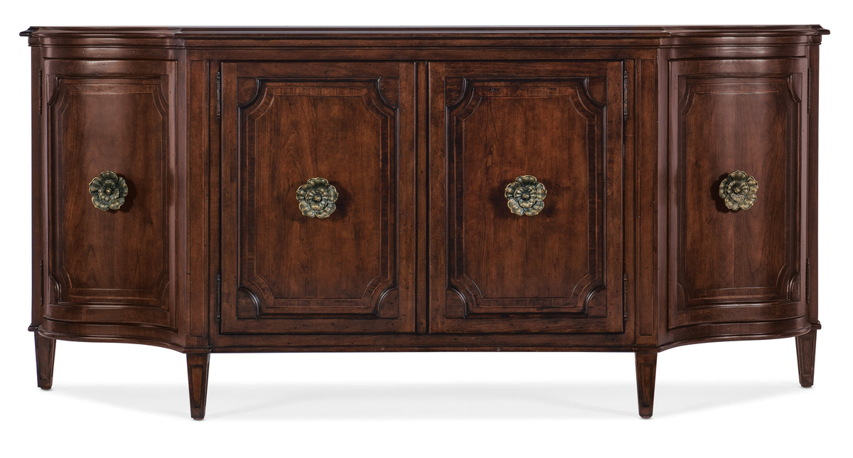 a brown wooden cabinet with gold knobs