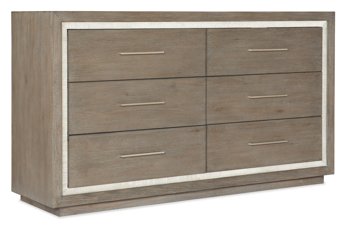 a brown dresser with white trim