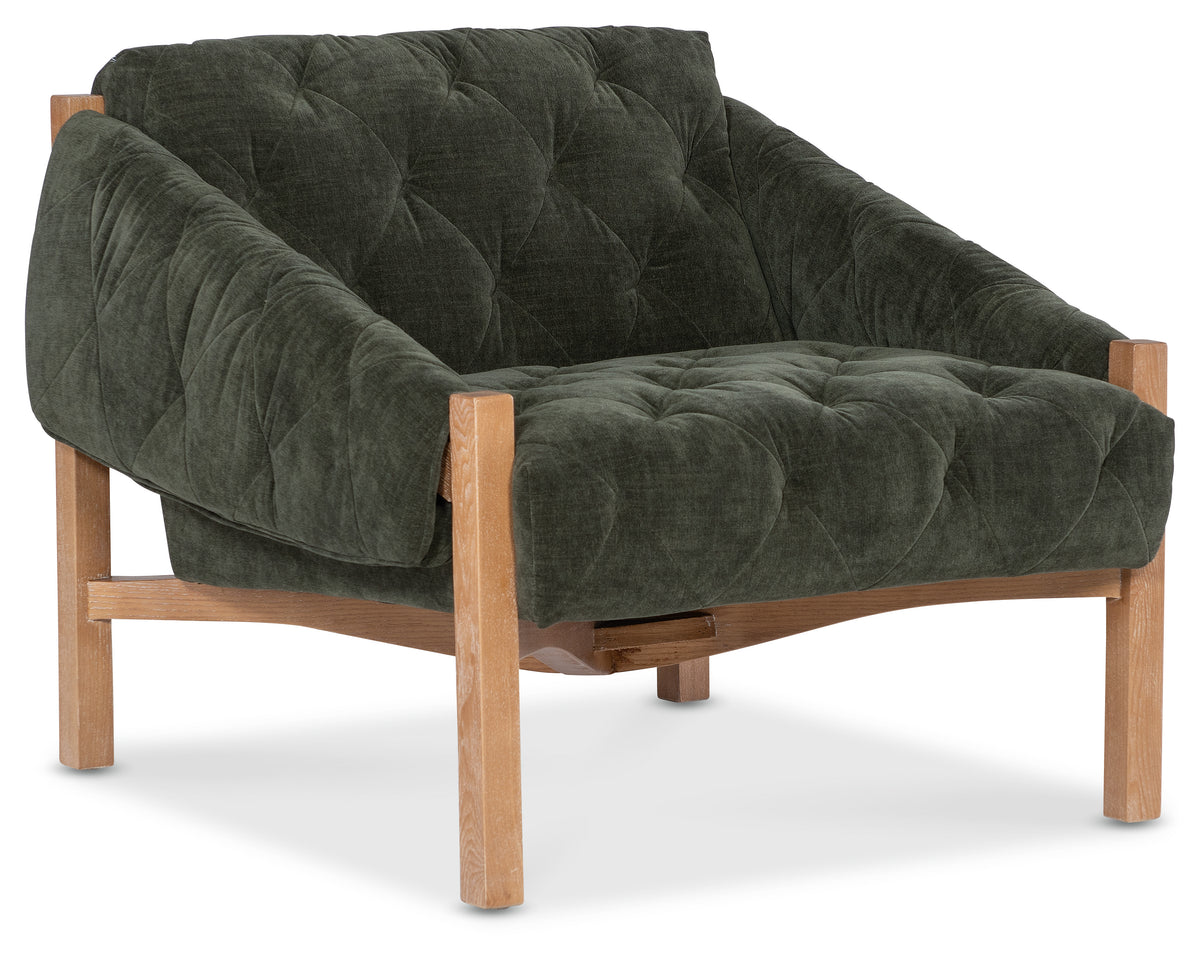 a green chair with wooden legs