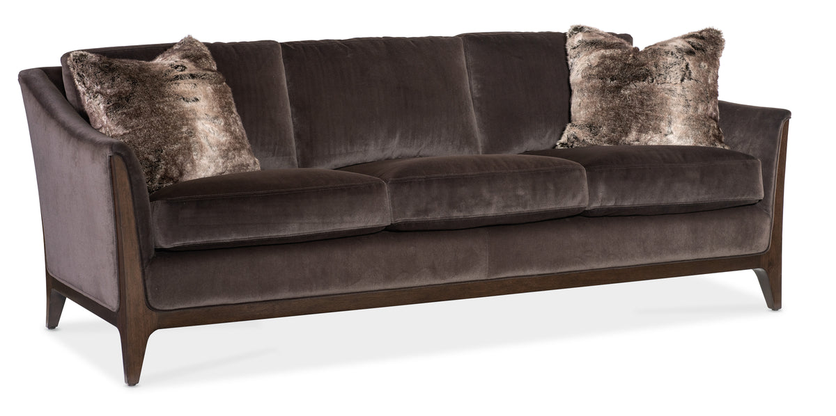 a brown couch with pillows
