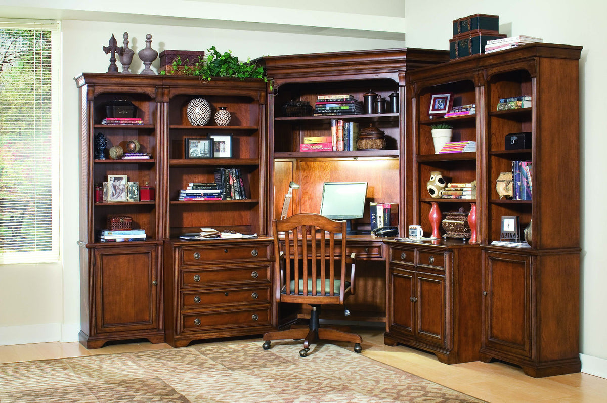 a desk and bookshelves in a room