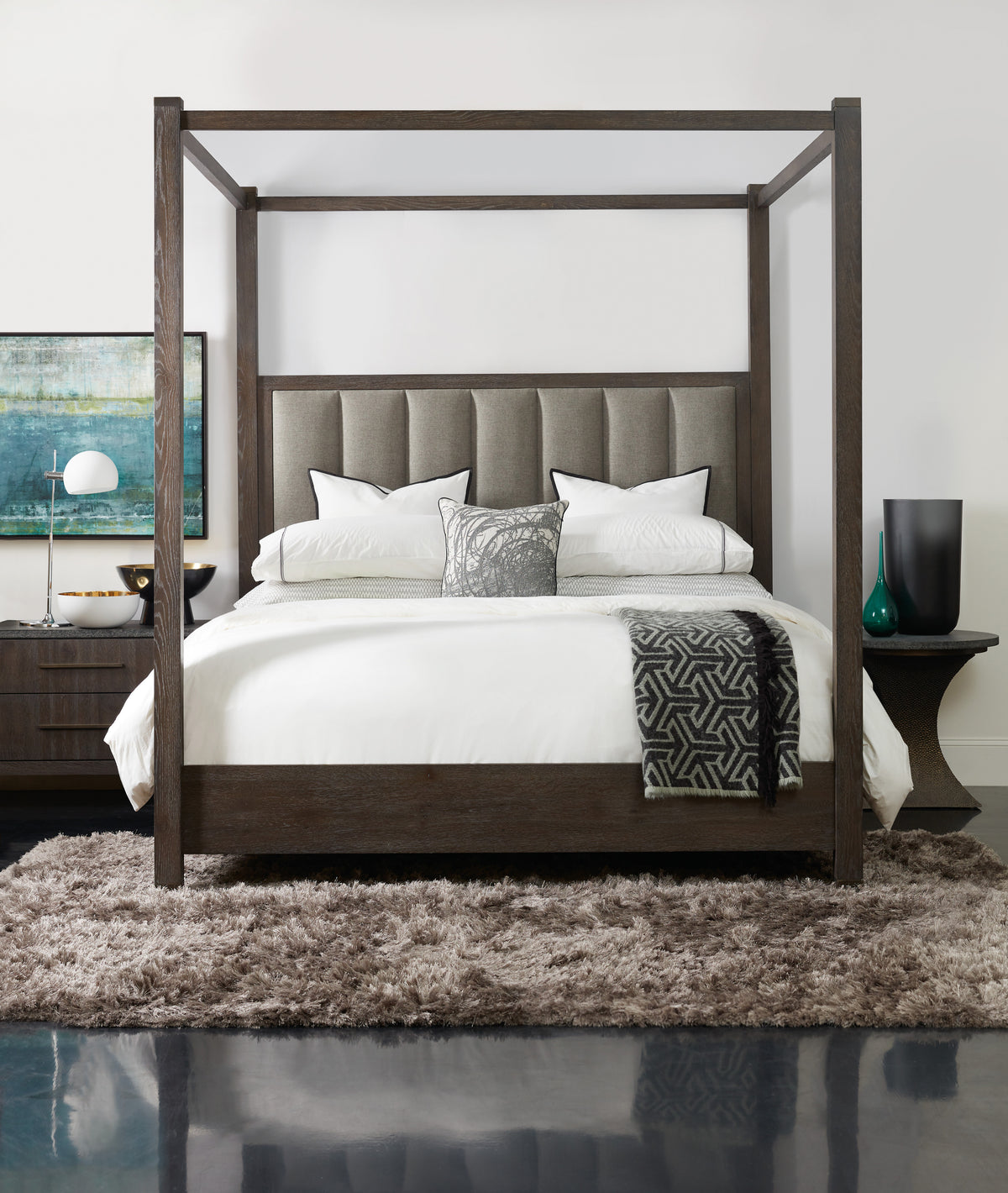 a bed with a four poster bed