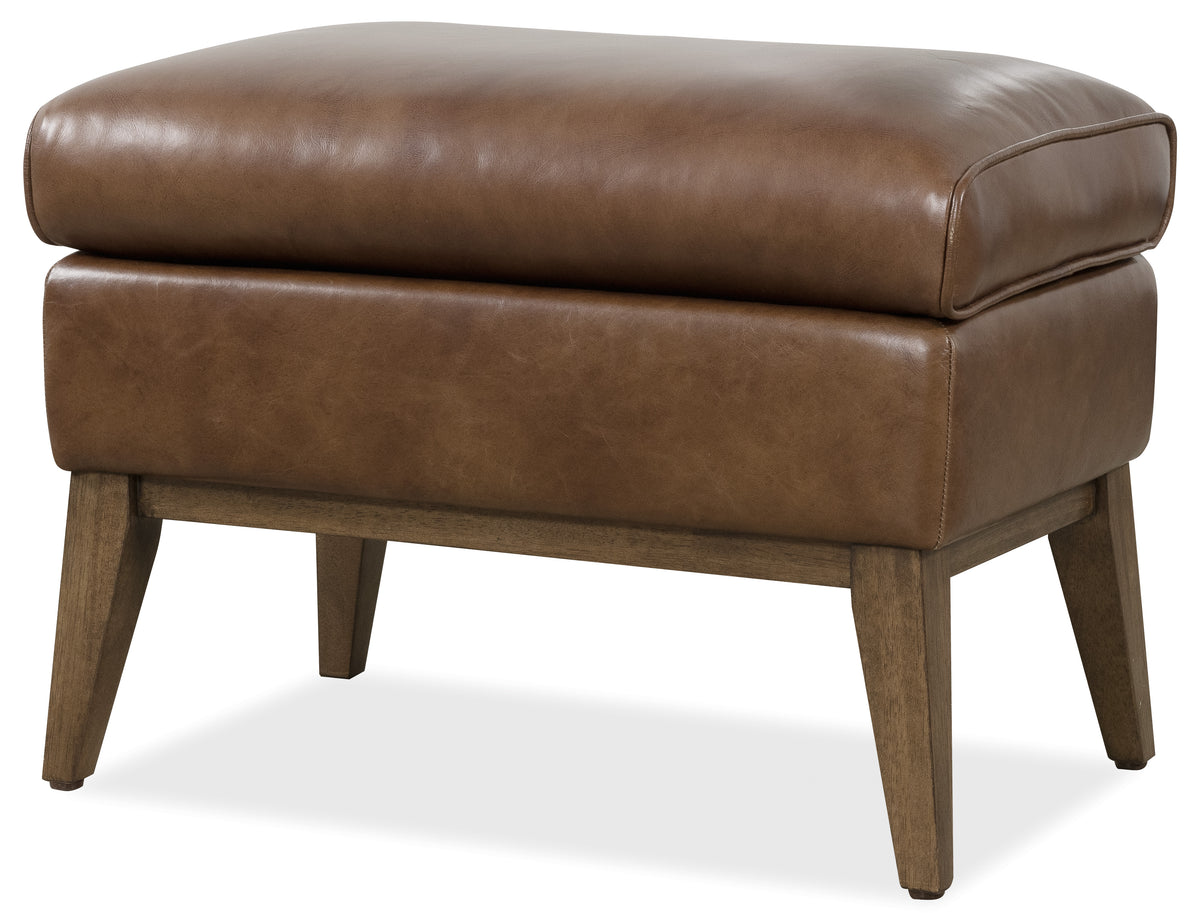 a brown leather ottoman with wooden legs