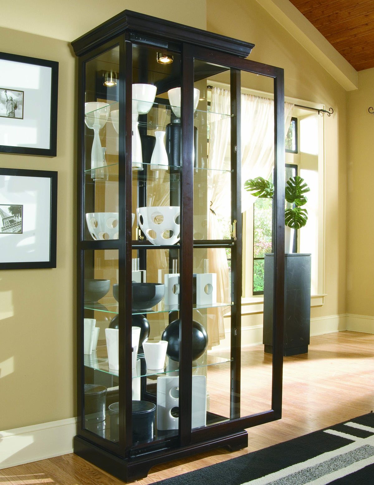 a glass cabinet with glass shelves