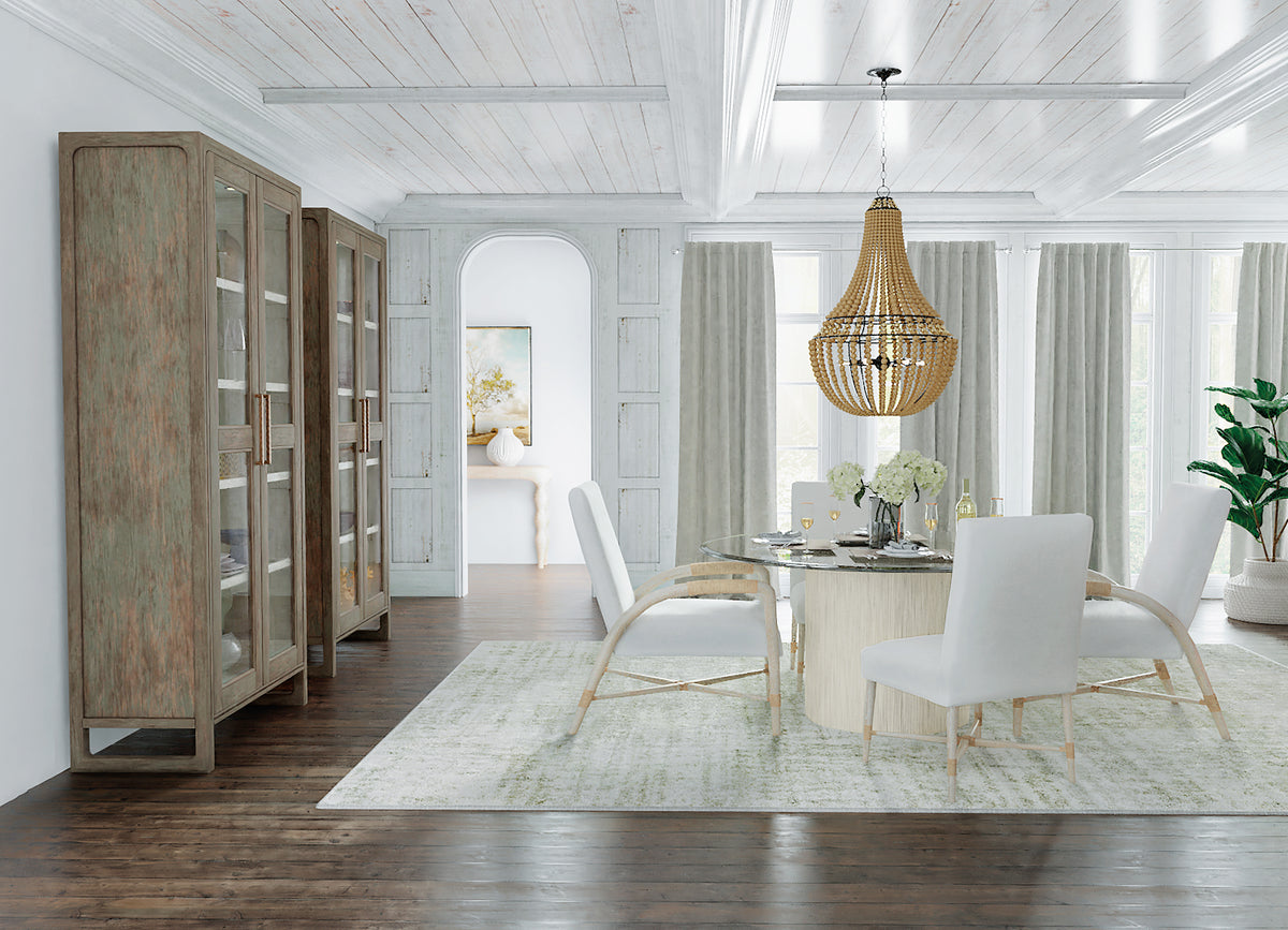 a dining room with a chandelier and a glass cabinet