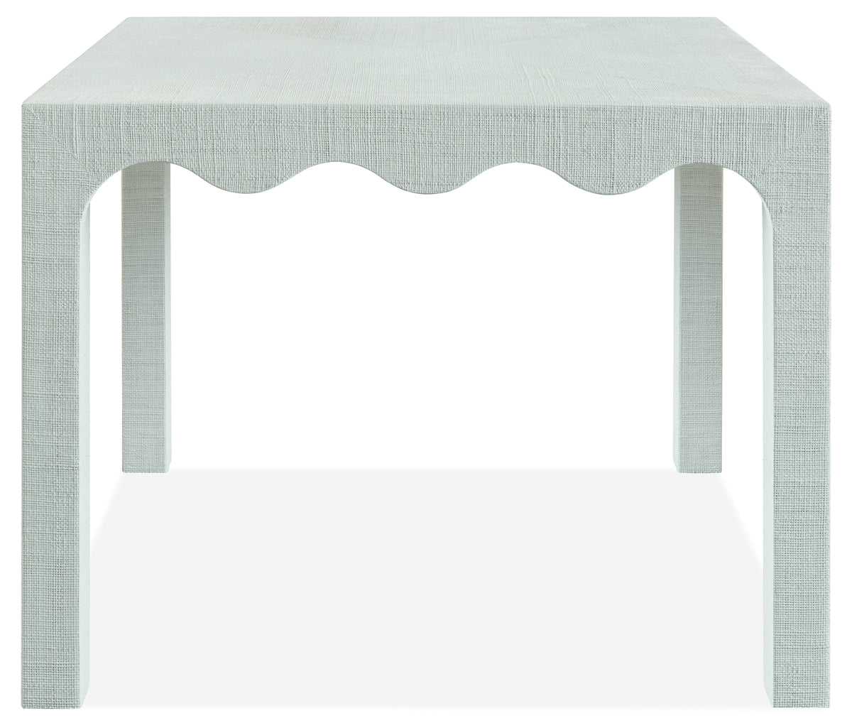a white table with a scalloped edge