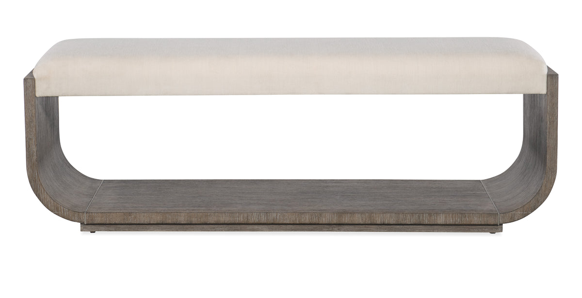a wooden shelf with a white cushion