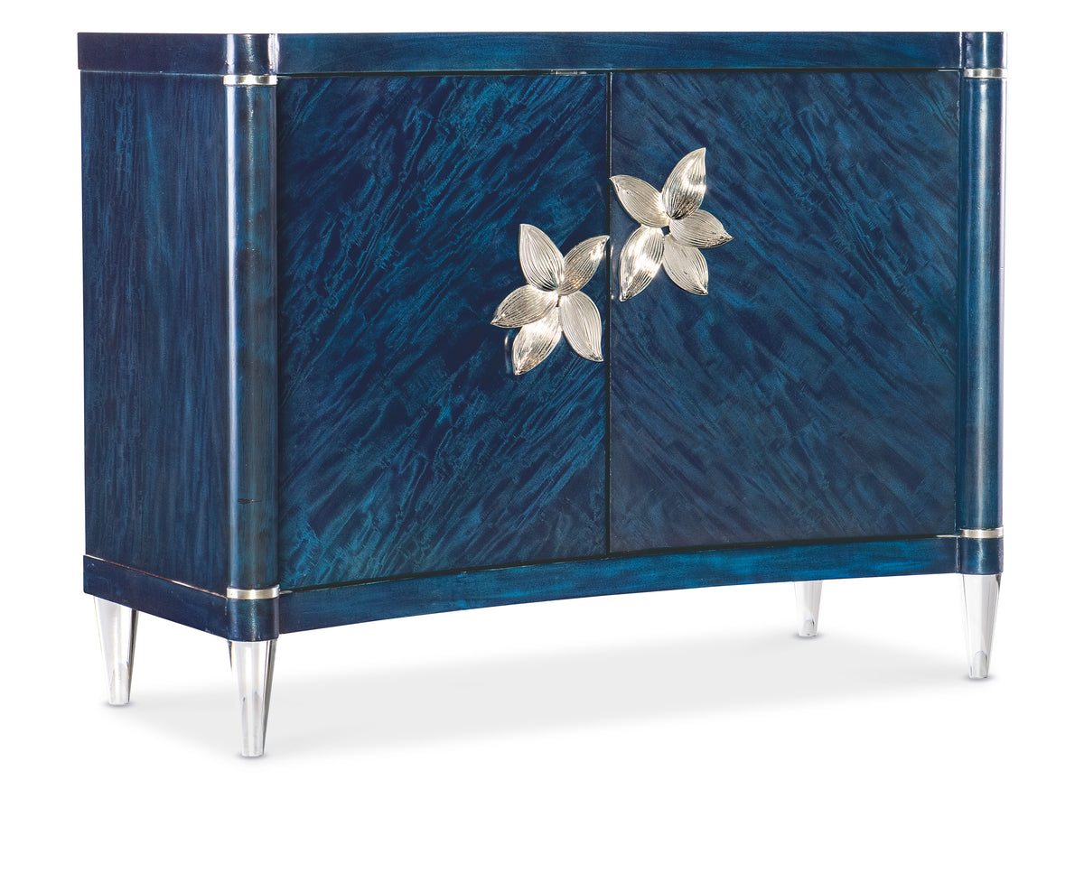 a blue cabinet with silver flowers on it