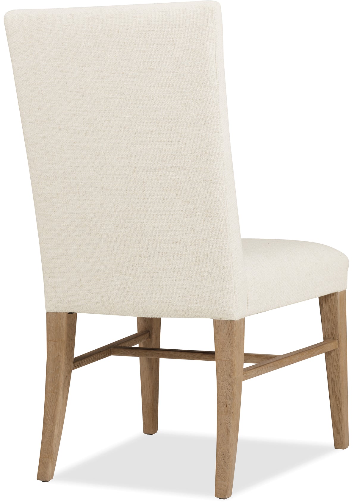 a white chair with wooden legs