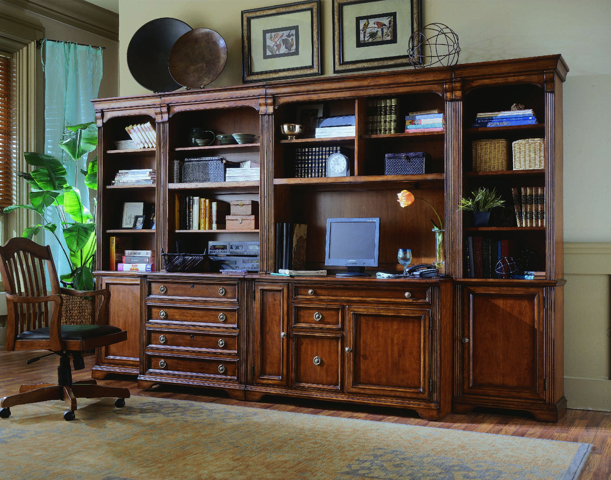 a large wooden cabinet with a computer